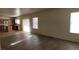 Bright living room with wood floors flows seamlessly into the kitchen and eating areas at 3021 New Journey Way, North Las Vegas, NV 89031