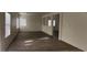 Bright and airy living room boasts hardwood floors and large windows that provide ample natural light at 3021 New Journey Way, North Las Vegas, NV 89031