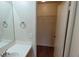 A bright interior of a bathroom shows a vanity and the door to a walk-in closet at 3125 N Buffalo Dr # 2104, Las Vegas, NV 89128