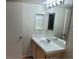 Bright bathroom with vanity sink, mirror with medicine cabinet, and a towel ring at 3125 N Buffalo Dr # 2104, Las Vegas, NV 89128