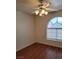 Comfortable bedroom featuring a modern ceiling fan, hard wood floors and arched window at 3125 N Buffalo Dr # 2104, Las Vegas, NV 89128