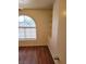 Cozy bedroom with hardwood floors, built in shelves and a arched window at 3125 N Buffalo Dr # 2104, Las Vegas, NV 89128