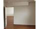 An interior view of a bedroom boasting hardwood floors and bright, neutral paint at 3125 N Buffalo Dr # 2104, Las Vegas, NV 89128