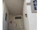 Entryway to unit with secure door, overhead lighting, and a decorative wreath at 3125 N Buffalo Dr # 2104, Las Vegas, NV 89128