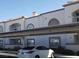Apartment complex featuring covered parking, neutral color scheme, and well-kept landscaping at 3125 N Buffalo Dr # 2104, Las Vegas, NV 89128