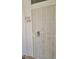 Apartment front door with security screen, knob, deadbolt, and unit numbers 2105 & 2104 at 3125 N Buffalo Dr # 2104, Las Vegas, NV 89128