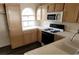 Well lit kitchen featuring a gas range, built in microwave and lots of cabinet storage at 3125 N Buffalo Dr # 2104, Las Vegas, NV 89128