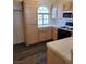 Kitchen featuring light wood cabinets, white countertops, and modern appliances at 3125 N Buffalo Dr # 2104, Las Vegas, NV 89128
