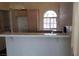 Eat in kitchen featuring lots of counter space and arched window above the kitchen sink at 3125 N Buffalo Dr # 2104, Las Vegas, NV 89128