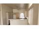 Spacious kitchen with an eat in bar, lots of storage, ceiling fan and access to other rooms at 3125 N Buffalo Dr # 2104, Las Vegas, NV 89128