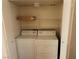 Functional laundry room featuring a stacked washer and dryer for space-saving convenience at 3125 N Buffalo Dr # 2104, Las Vegas, NV 89128
