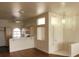 Open-concept living area with wood floors flowing into the adjoining kitchen area at 3125 N Buffalo Dr # 2104, Las Vegas, NV 89128