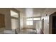 Open concept living area featuring lots of natural light and wood floors at 3125 N Buffalo Dr # 2104, Las Vegas, NV 89128
