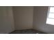 Carpeted bedroom featuring neutral paint, base trim and a window for natural light at 3644 Starlight Evening St, Las Vegas, NV 89129
