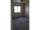 A cozy bedroom offers natural light and grey carpeting at 3644 Starlight Evening St, Las Vegas, NV 89129
