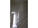 Spacious entryway features stairs, tile flooring, and a decorative light fixture at 3644 Starlight Evening St, Las Vegas, NV 89129