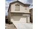 Inviting two-story home featuring a neutral color, attached garage, and low maintenance landscaping at 3644 Starlight Evening St, Las Vegas, NV 89129