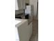A kitchen with speckled granite countertops, light cabinetry, and tile flooring at 3644 Starlight Evening St, Las Vegas, NV 89129