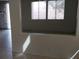Bright living space featuring a pass-through window and neutral color palette at 3644 Starlight Evening St, Las Vegas, NV 89129