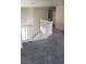 Second floor landing features a white railing and grey carpeting at 3644 Starlight Evening St, Las Vegas, NV 89129