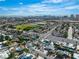 An aerial view of a vibrant Las Vegas neighborhood with lush trees and the city skyline, conveniently located near local amenities at 3647 Ottawa Cir, Las Vegas, NV 89169