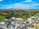 A bird's eye view shows the neighborhood and the home's proximity to the Las Vegas National Golf Course and surrounding mountains at 3647 Ottawa Cir, Las Vegas, NV 89169
