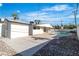 Features a spacious backyard with a pool and patio, accented by desert landscaping and a detached garage at 3647 Ottawa Cir, Las Vegas, NV 89169