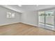 Light and bright bedroom with wood-look floors and access to the backyard patio at 3647 Ottawa Cir, Las Vegas, NV 89169