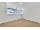 Bright bedroom featuring modern flooring, recessed lights, and updated windows with views at 3647 Ottawa Cir, Las Vegas, NV 89169