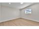Neutral bedroom featuring updated floors and a large window allowing for ample natural light at 3647 Ottawa Cir, Las Vegas, NV 89169