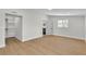 Spacious bedroom features wood-look floors, a walk-in closet, and ensuite bathroom at 3647 Ottawa Cir, Las Vegas, NV 89169