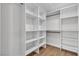 Walk-in closet with wood flooring and multiple shelves and storage options at 3647 Ottawa Cir, Las Vegas, NV 89169