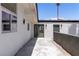 Exterior view of house with sliding doors and walkway at 3647 Ottawa Cir, Las Vegas, NV 89169