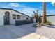 Modern home featuring desert landscaping and a private courtyard entrance at 3647 Ottawa Cir, Las Vegas, NV 89169