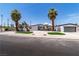 Charming home featuring desert landscaping, palm trees, and a modern design at 3647 Ottawa Cir, Las Vegas, NV 89169