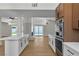 Open concept kitchen with island, stainless steel appliances, and modern fixtures at 3647 Ottawa Cir, Las Vegas, NV 89169