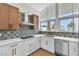 Bright kitchen featuring stainless steel appliances, modern cabinetry, and a stylish backsplash at 3647 Ottawa Cir, Las Vegas, NV 89169