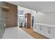 Bright kitchen with a stainless refrigerator, white cabinets, and light wood flooring at 3647 Ottawa Cir, Las Vegas, NV 89169