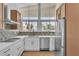 Modern kitchen with white countertops, stainless steel appliances, and ample natural light at 3647 Ottawa Cir, Las Vegas, NV 89169