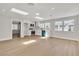 Open-concept kitchen and living area with skylights and stainless steel appliances at 3647 Ottawa Cir, Las Vegas, NV 89169