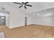 Open-concept living room featuring wood-look floors and contemporary lighting at 3647 Ottawa Cir, Las Vegas, NV 89169