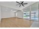 Open living area with ceiling fan and sliding glass doors that open to a pool at 3647 Ottawa Cir, Las Vegas, NV 89169