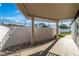Covered patio area with concrete flooring, privacy wall, and view of the backyard at 3647 Ottawa Cir, Las Vegas, NV 89169