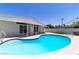 Beautiful backyard pool with ample deck space and ladder in a charming home at 3647 Ottawa Cir, Las Vegas, NV 89169