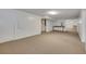 Spacious carpeted basement with neutral tones and white trim throughout, ideal for a recreation room at 415 Emerald Cir, Henderson, NV 89002