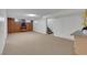Finished basement with wood-burning fireplace and stairs to main floor at 415 Emerald Cir, Henderson, NV 89002