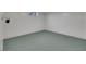 Simple basement room featuring solid colored floors, easily adaptable to different needs and purposes at 415 Emerald Cir, Henderson, NV 89002