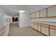 Finished basement with extensive built-in storage and adjacent finished area, offers versatile use at 415 Emerald Cir, Henderson, NV 89002