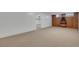 Spacious basement area with wood-paneled accent wall and additional room at 415 Emerald Cir, Henderson, NV 89002