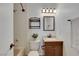 Cozy bathroom with tiled shower-tub combination, and vanity with a light-toned countertop at 415 Emerald Cir, Henderson, NV 89002